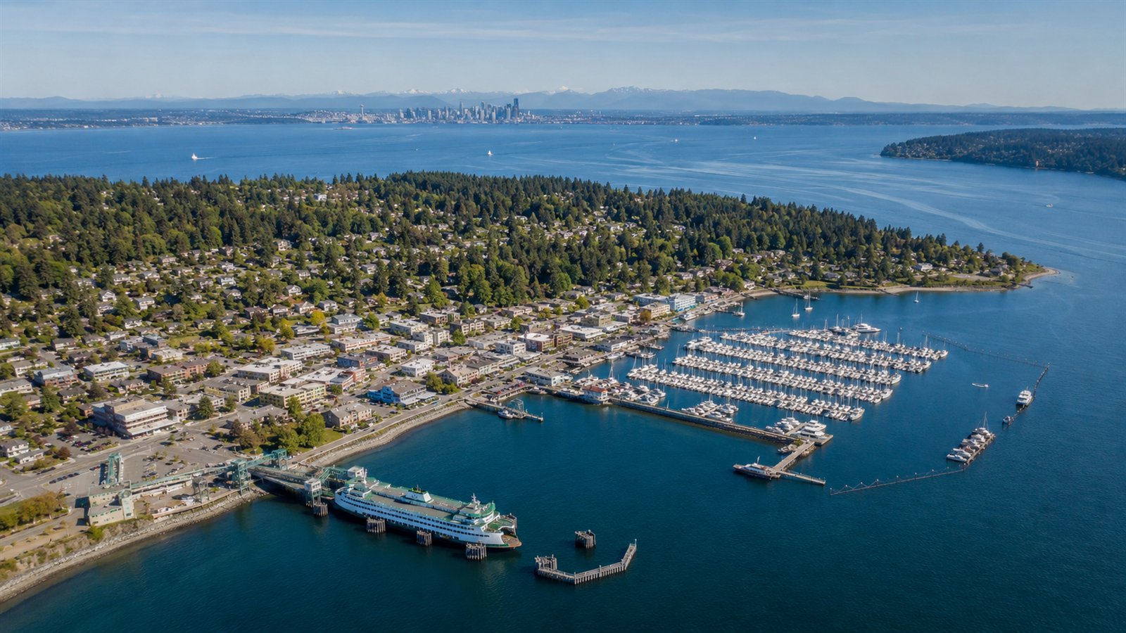 Aerial drone view of Eagle Harbor and Winslow on Bainbridge Island with the ferry